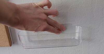 Press caddy onto wall
