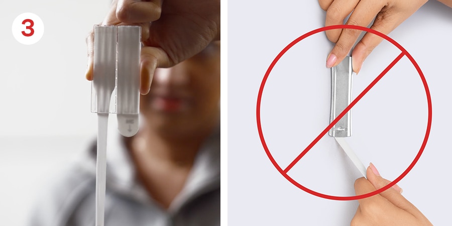 Shows using the other hand to pull the strips down against the wall to remove.