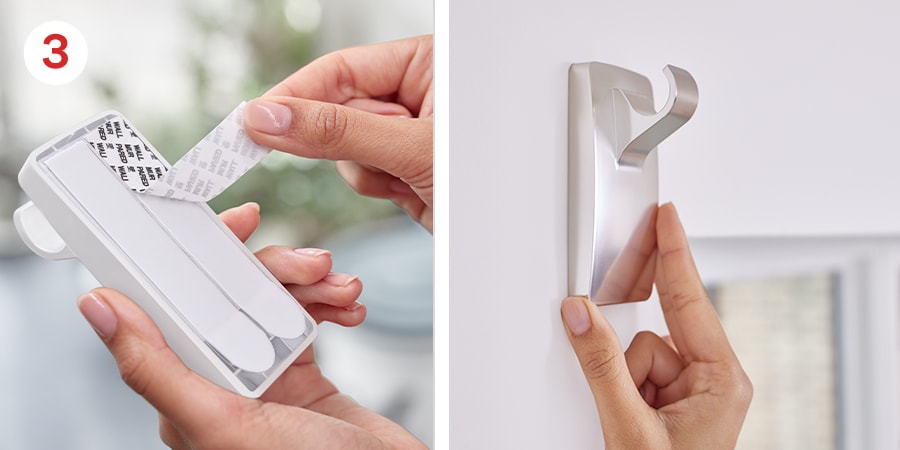 Hands show removing the black liners from the strips and pressing the hook against the wall.