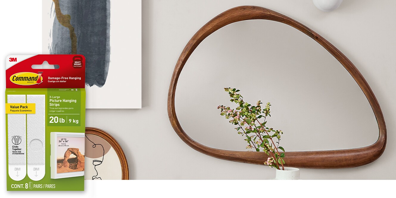 A mirror hanging on the wall using Command™ 20lb X-Large Picture Hanging Strips.
