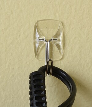 Hang Command™ Utensil Hooks to hold larger items, like an embossing tool.

