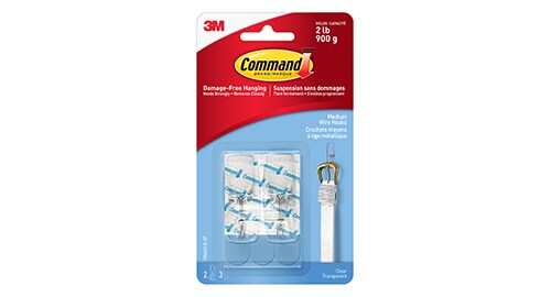 Two Command™ Clear Hooks in their packaging.
