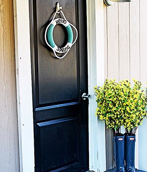Add in slim, glass vases into the boots to hold water for freshly cut branches
