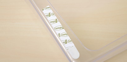 Use Command™ Narrow Picture Hanging Strips to mount wall pocket to hold scrapbooking paper and stickers.
