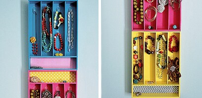 A colorful custom jewelry box hanging on a wall.
