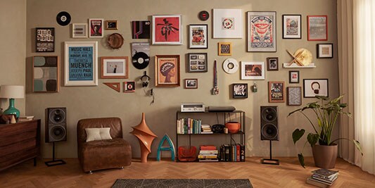 many framed photos hanging on a wall
