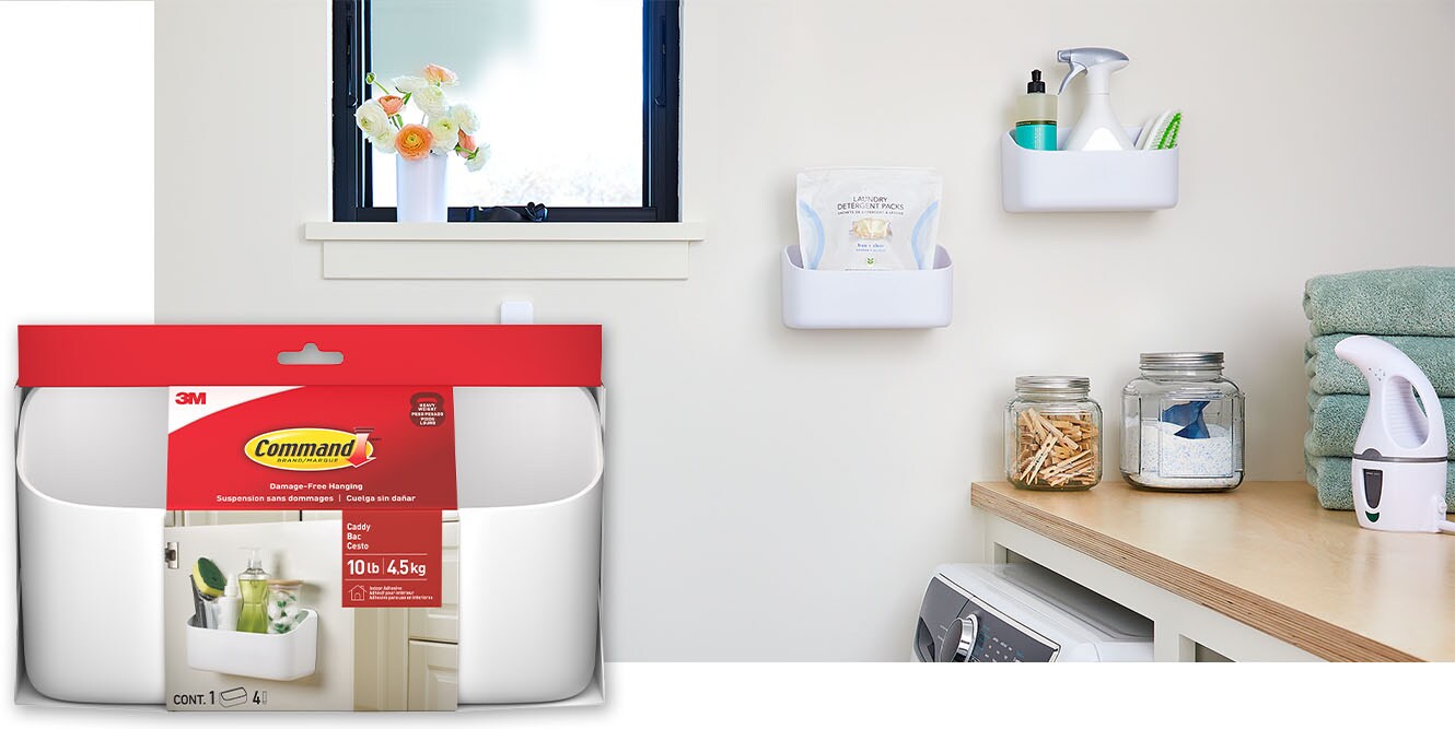 Two Command™ 10 lb Organizing Caddy​s holding cleaning
