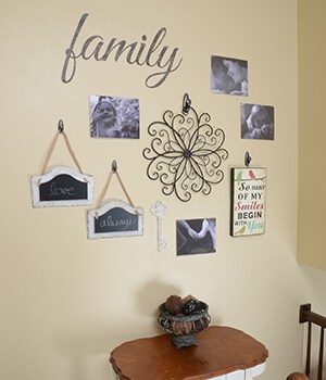 Use CommandTM Forever Classic Oil-Rubbed Bronze Metal Hooks to hang the metal wall art and any items on ribbons
