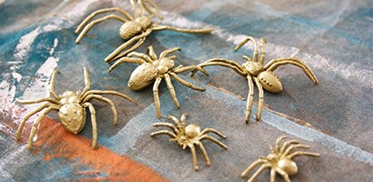Once the glue is dry, coat the cardboard piece and twigs with white spray paint
