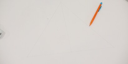 Sketch triangle on cardboard
