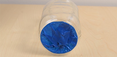 Use Scotch Blue Painter's Tape to cover the bottom of the jar to keep the paint off of it.
