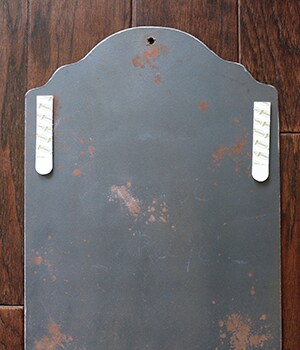 After one hour, remount the chalkboard on the door and use chalk to write out meal plans for each week on the board
