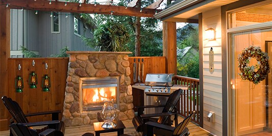 A cozy deck with built-in fireplace.
