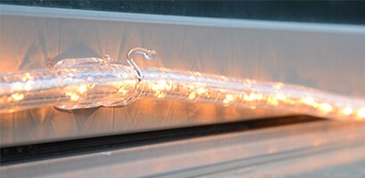 Adhere Command™ Outdoor Rope Light Clips every 2 feet around the area you want to light. Wait one hour
