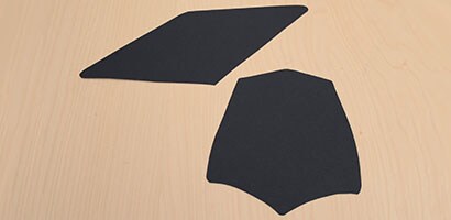 mortarboard and card stock cut outs shaped to look like a graduation hat.
