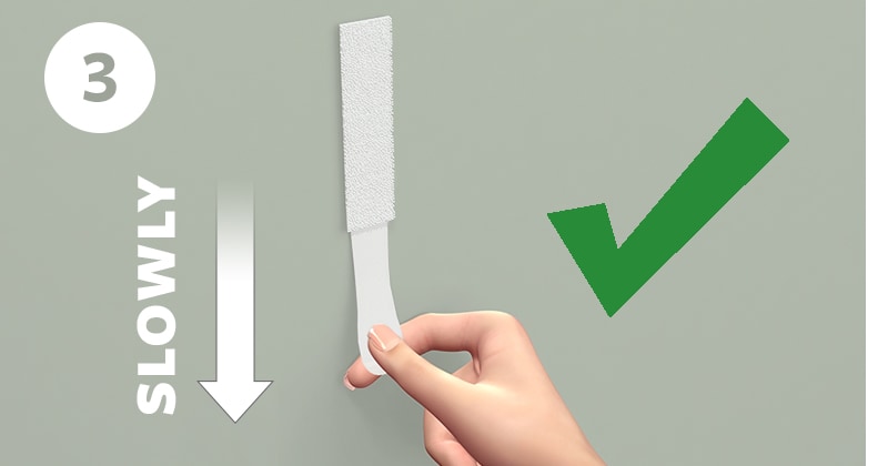 STep 3 - Stretch strips slowly against the wall at least 15 inches (38 cm) to release.
